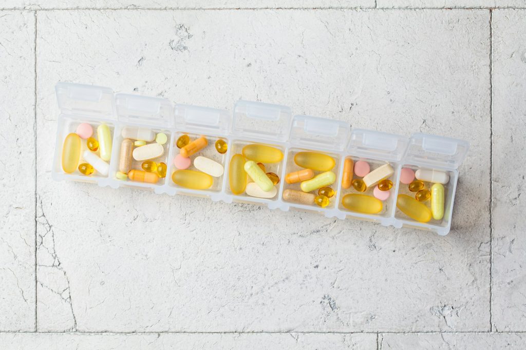 Pills box for daily intake of vitamins and medicines.
