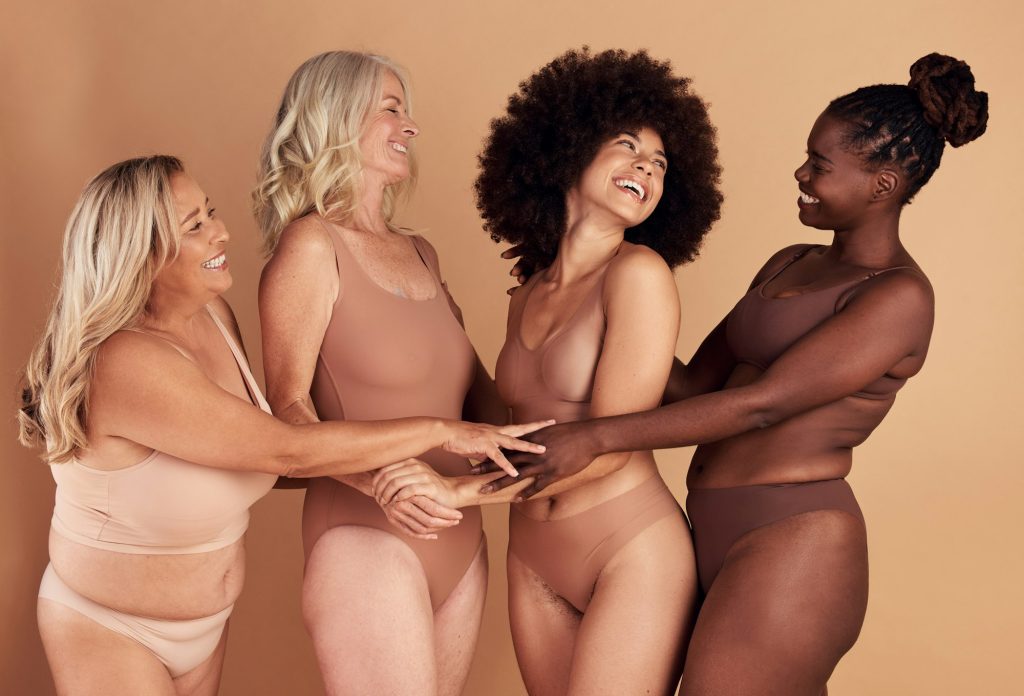 Support, love and diversity of women in underwear, beauty collaboration and smile for body positivi